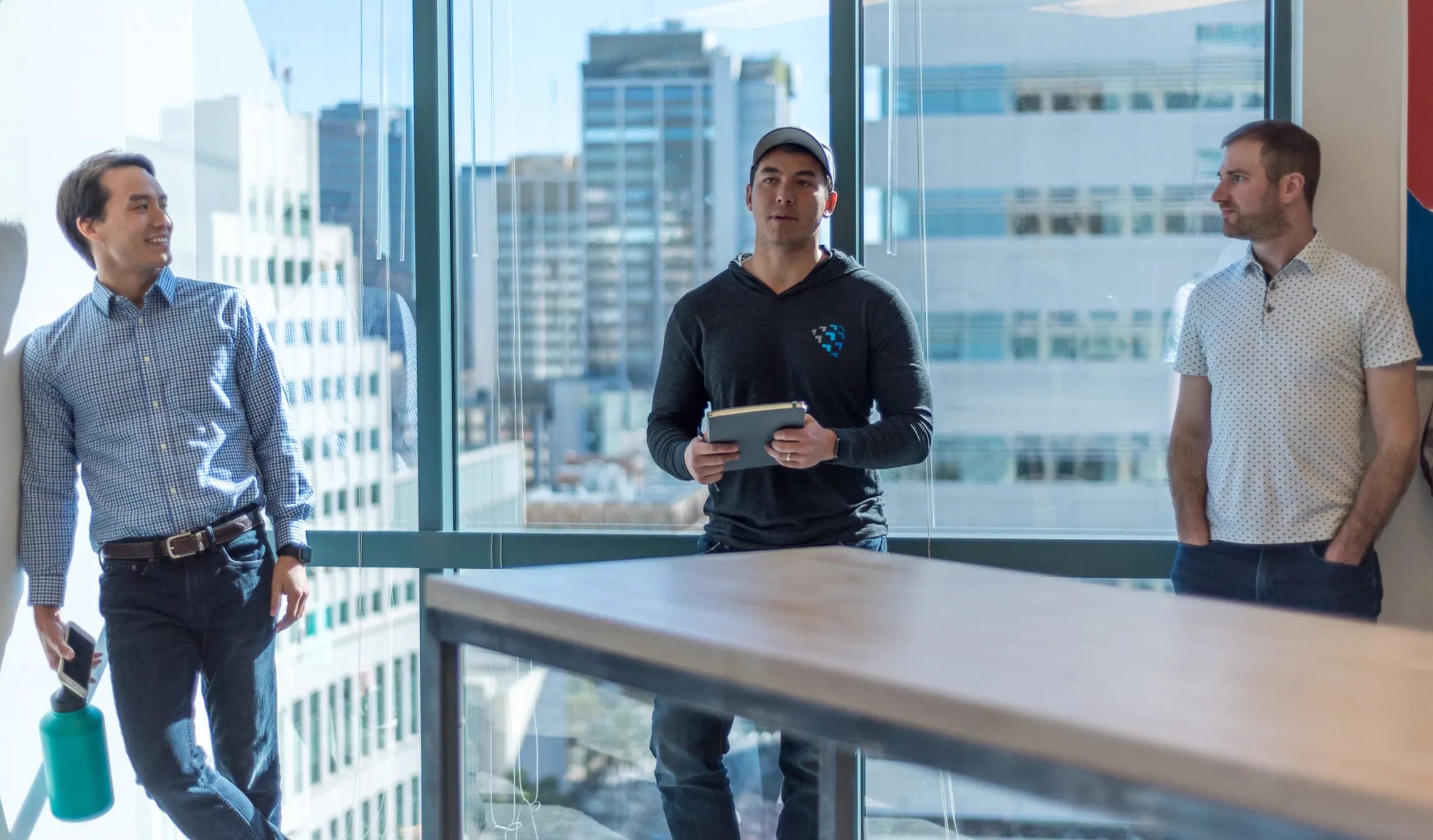 The Team Behind Shield AI – Tumisang Bogwasi Shield AI founders Ryan Tseng, Brandon Tseng, and Nathan Michael standing together, representing the leadership behind the autonomous defense tech company.