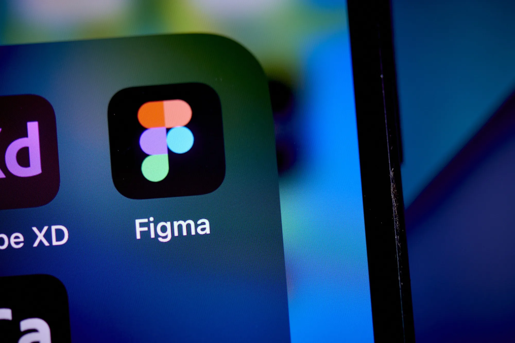 Figma App Icon on Mobile Interface – Tumisang Bogwasi Close-up of the Figma mobile app icon next to Adobe XD on a smartphone screen.