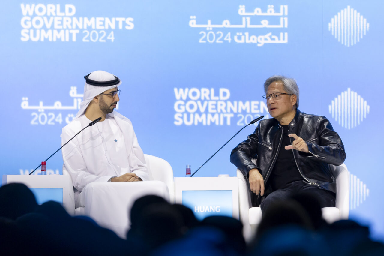 Jensen Huang Discusses the Global AI Future at the World Government Summit – Tumisang Bogwasi Jensen Huang speaking on stage with a moderator at the World Government Summit 2024 in Dubai, discussing artificial intelligence and technology policy.