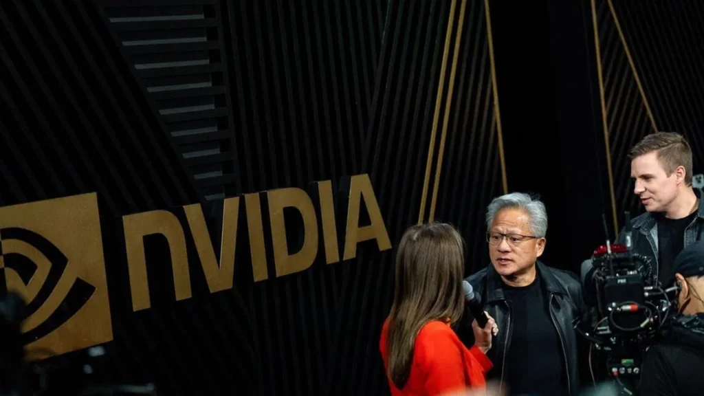 Nvidia Leadership Engages with Media at Global Technology Event – Tumisang Bogwasi Technology executive being interviewed by media representatives at an Nvidia event with the Nvidia logo displayed in the background.