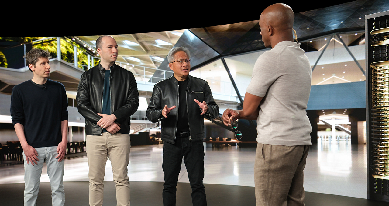 Tech Titans Discuss the 0Bn Prtnership and Future of AI Infrastructure – Tumisang Bogwasi Four technology executives in conversation in a modern corporate setting discussing AI and computing innovation.