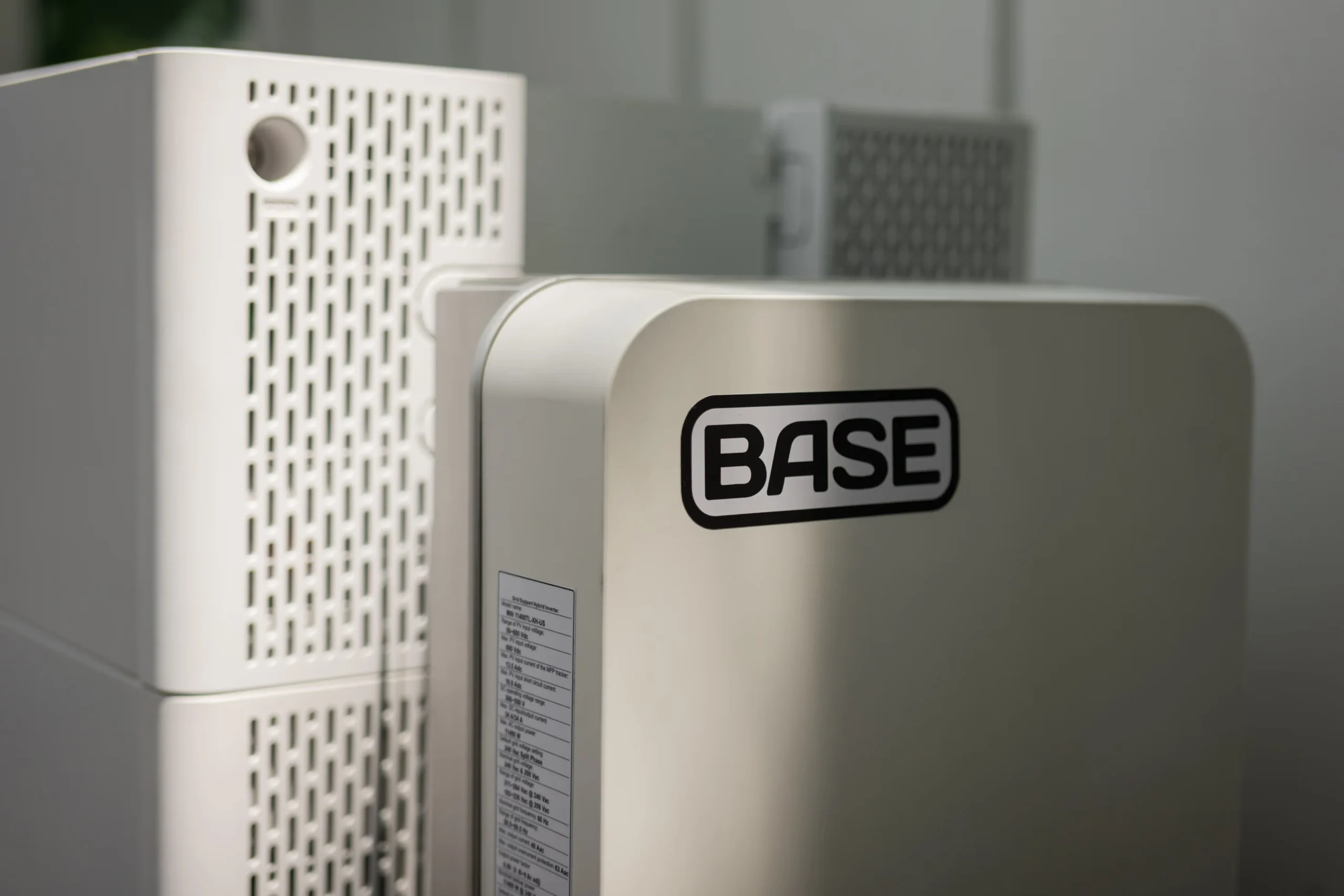 Base Home Energy System Close-Up – Tumisang Bogwasi Close-up of a Base-branded home energy storage unit with a clean, minimalist design and ventilation panels.