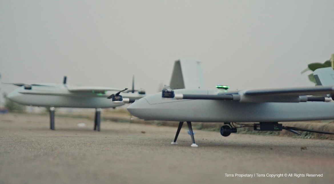 Field Validation of Autonomous Aerial Systems – Tumisang Bogwasi Multiple Terra Industries autonomous fixed-wing aerial systems positioned on the ground during a field exercise, prepared for coordinated autonomous operations.