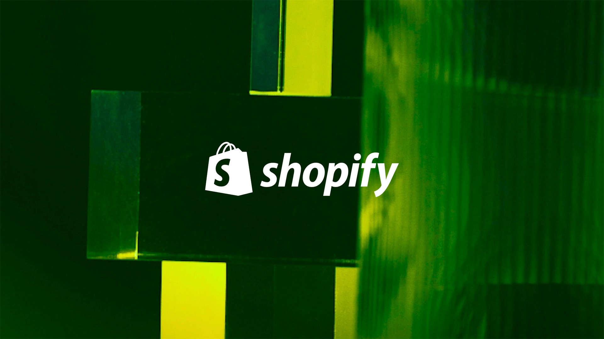 Shopify logo with shopping bag icon on a green illuminated background.