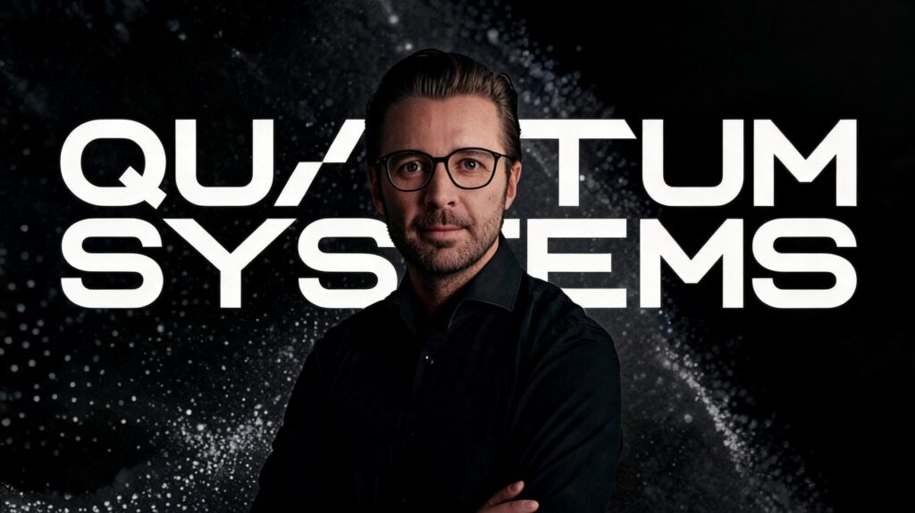 Florian Seibel Co-Founder and CEO of Quantum Systems – Tumisang Bogwasi Portrait of Florian Seibel, co-founder and CEO of Quantum Systems, standing in front of the company logo with arms crossed.