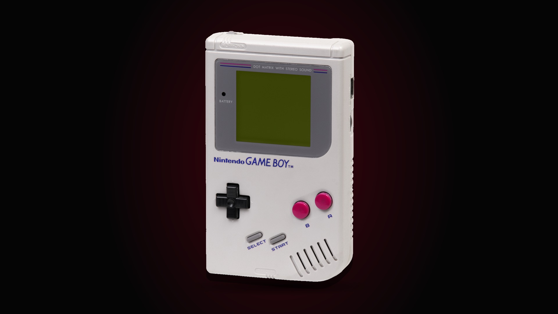 A 1989 Nintendo Game Boy with its grey monochrome screen, against a black background