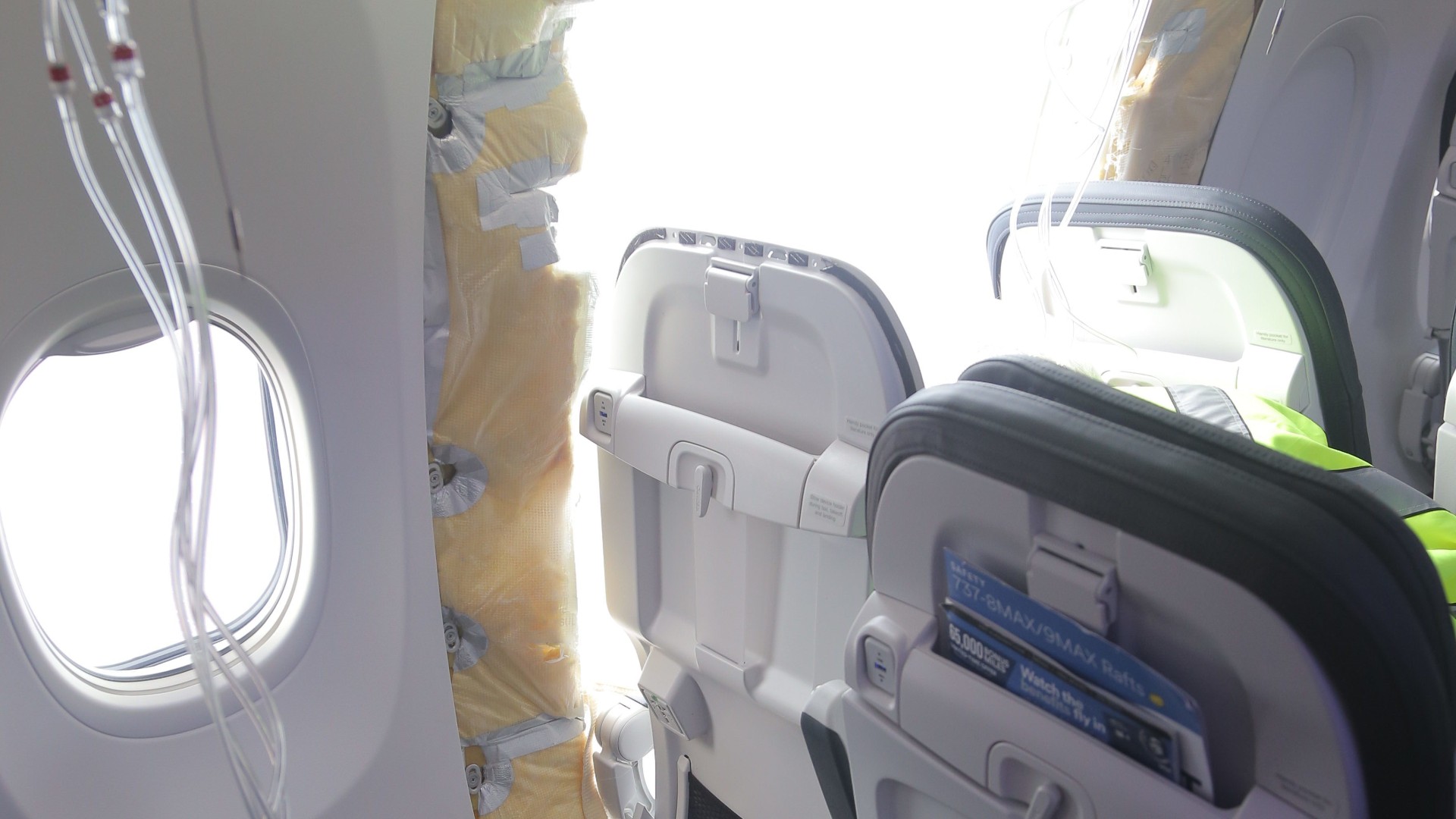 Interior of Alaska Airlines Flight 1282 showing the opening in the fuselage where the door plug separated