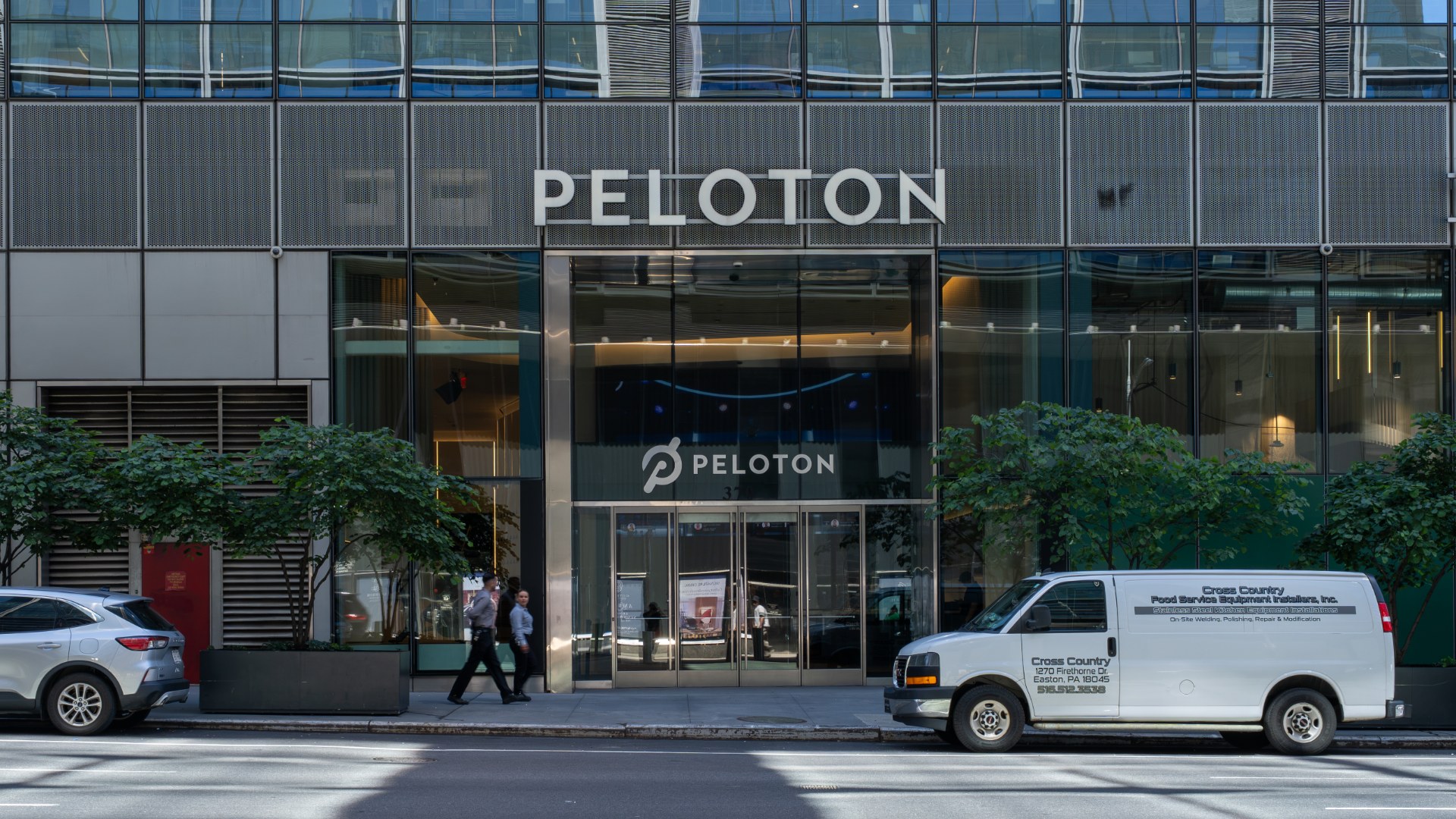The Peloton Studios building in Manhattan, with the PELOTON wordmark above a glass entrance