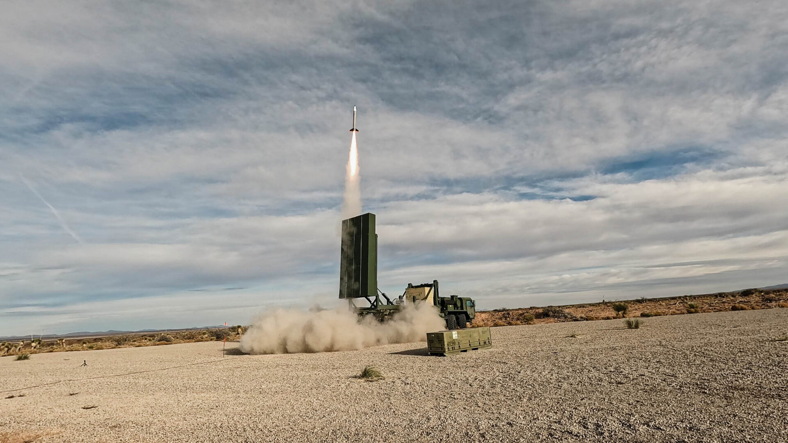 Castelion test missile lifting off from a truck-mounted launcher in the desert